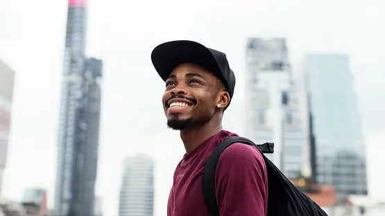 A man smiling after visiting the dentist