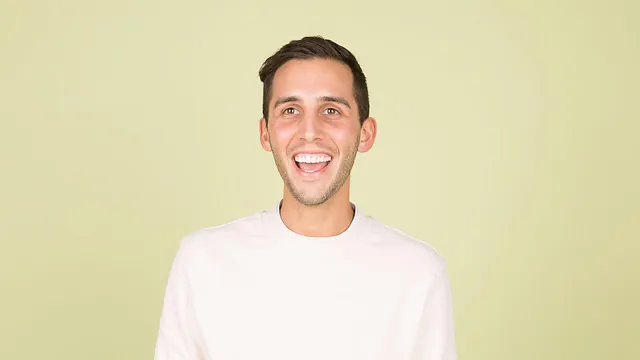 A man with perfect teeth smiling